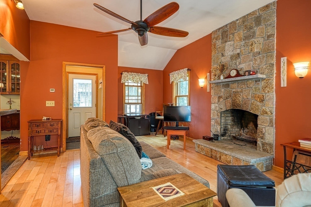 60 Coal Kiln Road Princeton, MA 01541 - Photo 8 of 31 a living room with furniture and a fireplace