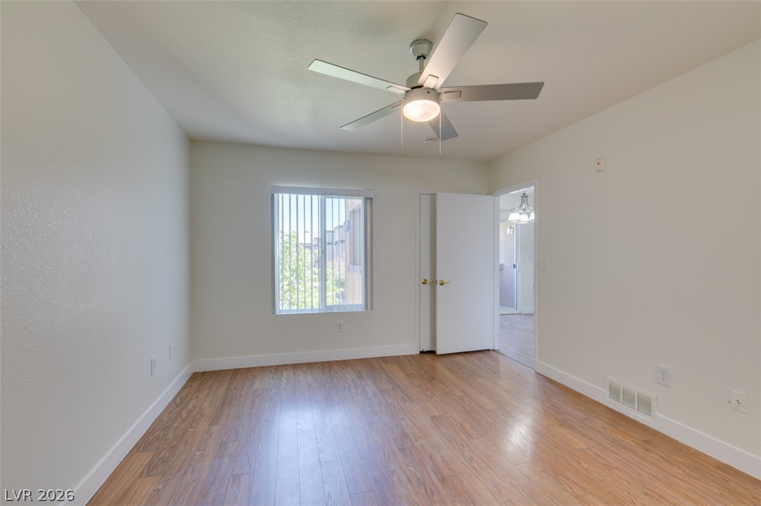 6650 West Warm Springs Road, Unit 2118 Las Vegas, NV 89118 - Photo 22 of 41 A well-proportioned bedroom with resilient flooring, ready for personalization.