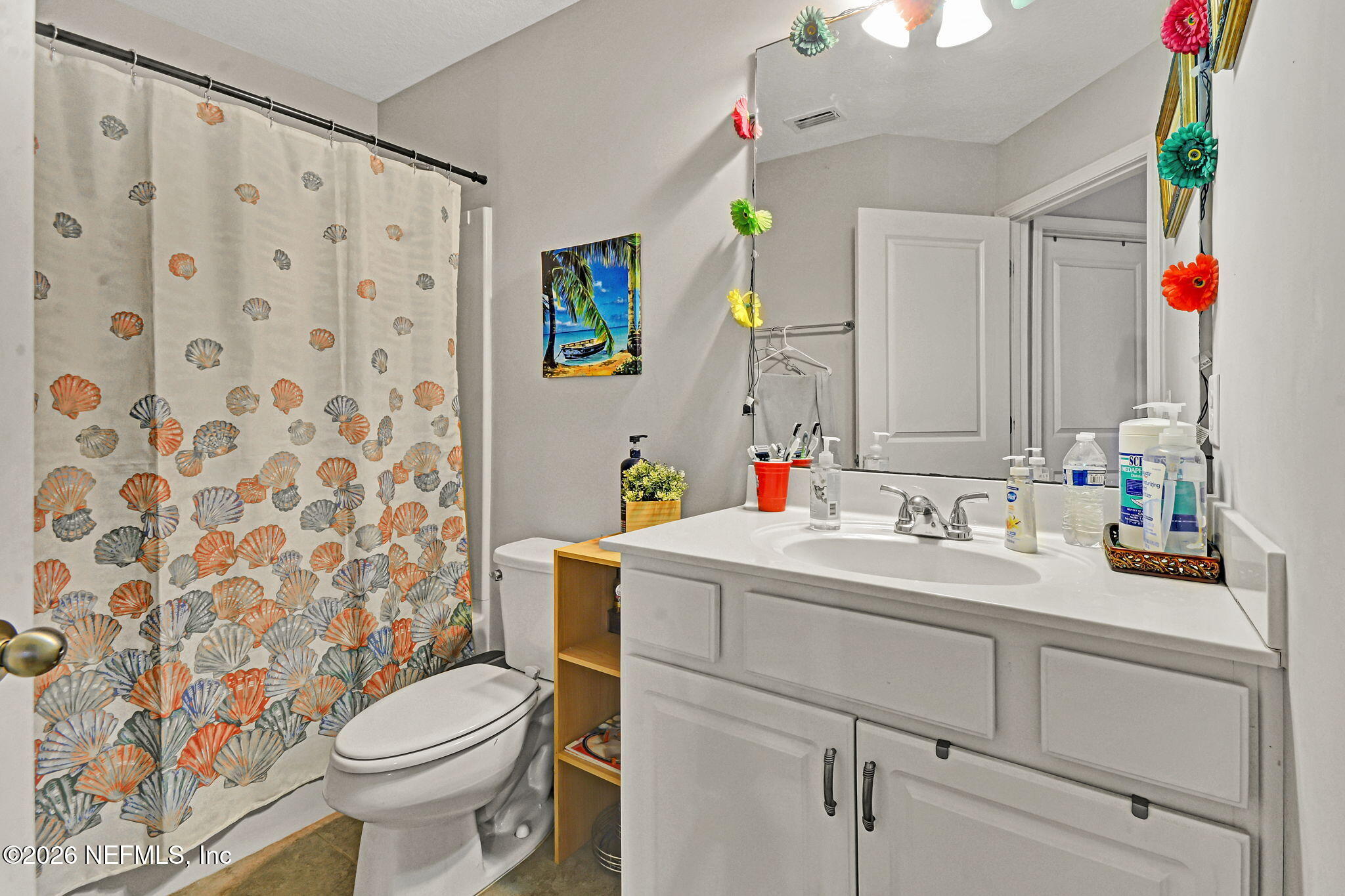 1537 Landau Road Jacksonville, FL 32225 - Photo 10 of 12 a bathroom with a sink vanity mirror and toilet