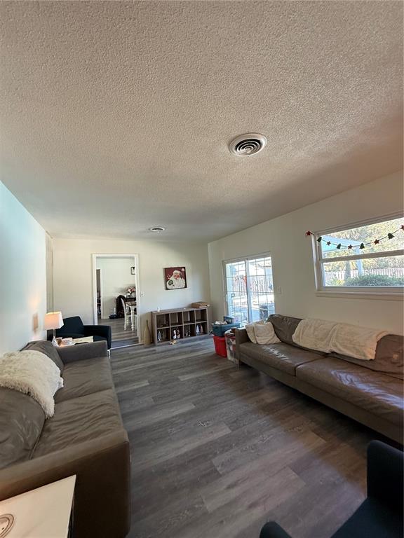 1021 Southwest 26th Street Ocala, FL 34471 - Photo 16 of 17 a living room with furniture and wooden floor