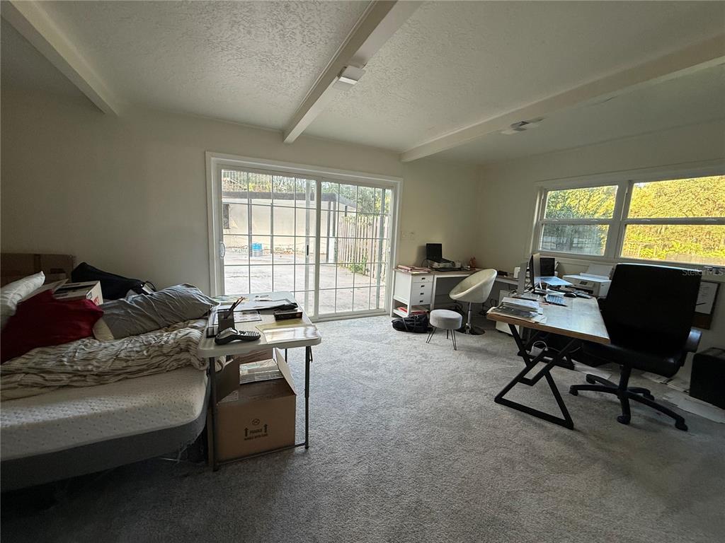 1021 Southwest 26th Street Ocala, FL 34471 - Photo 7 of 10 a living room with furniture and a window