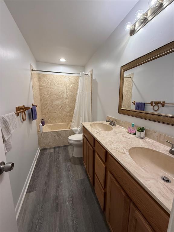 1021 Southwest 26th Street Ocala, FL 34471 - Photo 8 of 10 a bathroom with a granite countertop sink mirror vanity and toilet