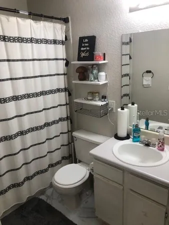 a kitchen with stainless steel appliances a refrigerator sink and cabinets