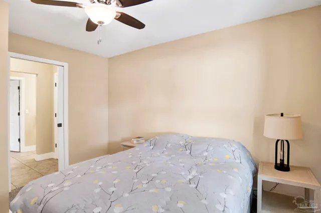 a bedroom with a bed and cabinets