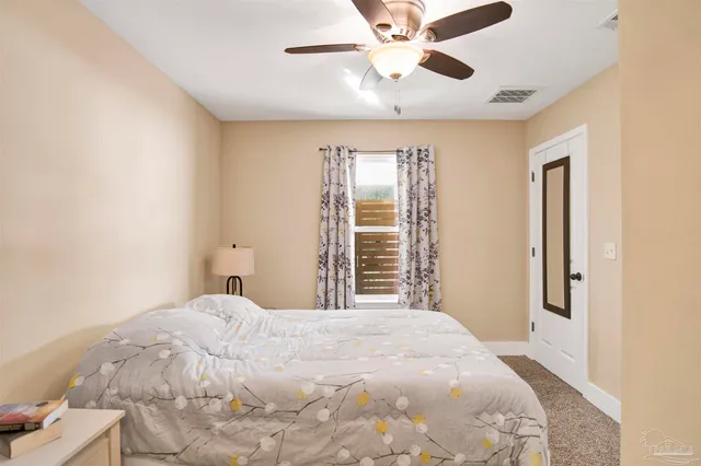 a large white bed in a white room