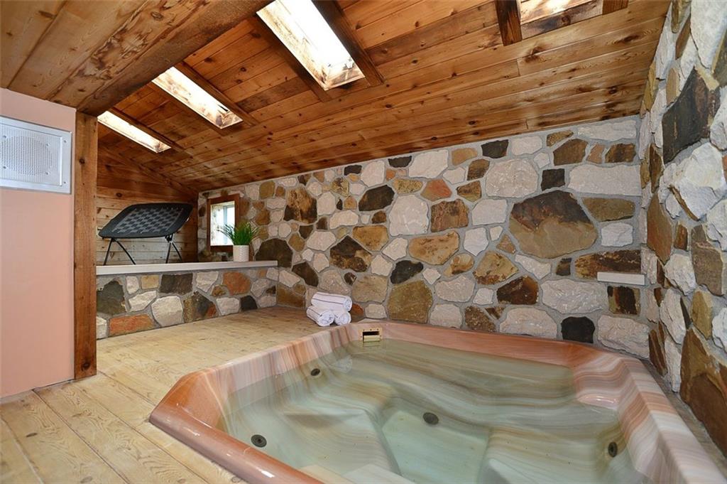 12780 Ridge Road North Huntingdon, PA 15642 - Photo 14 of 21 The hot tub area also has 4 gorgeous sky lights that flood the room with natural light and can provide serenity and calmness to your day without leaving your own home! The in-home audio system is heard in every room, including the hot tub area for even more relaxation.