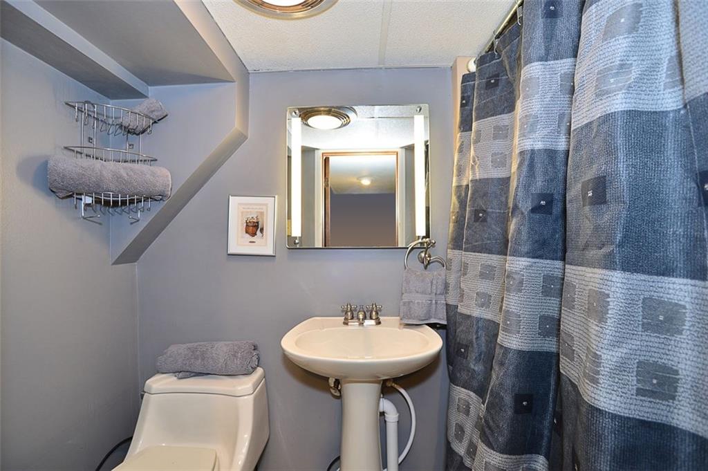 12780 Ridge Road North Huntingdon, PA 15642 - Photo 17 of 21 New paint, light fixtures and flooring give this full bathroom a modern feel and updated appearance.