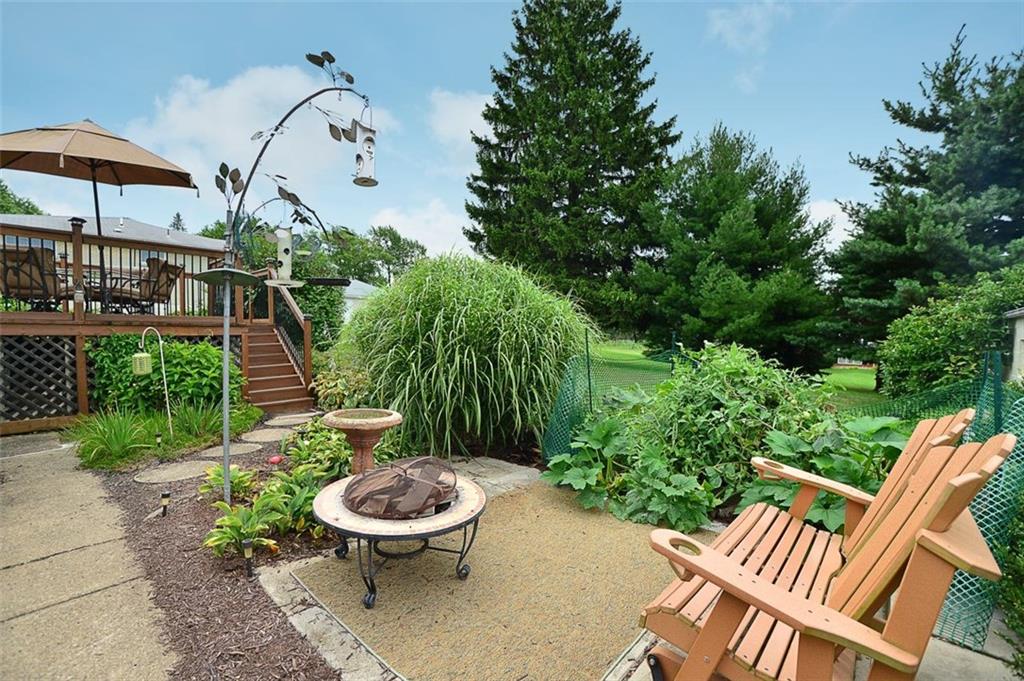 12780 Ridge Road North Huntingdon, PA 15642 - Photo 20 of 21 The firepit area on the patio is perfect for summer nights to enjoy the lush landscape and large yard.
