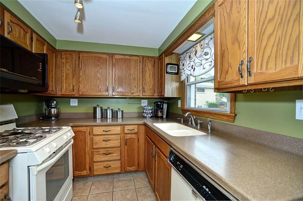 12780 Ridge Road North Huntingdon, PA 15642 - Photo 6 of 21 This fully functional kitchen includes new tiled flooring and countertops as well as a new garbage disposal and lighting.