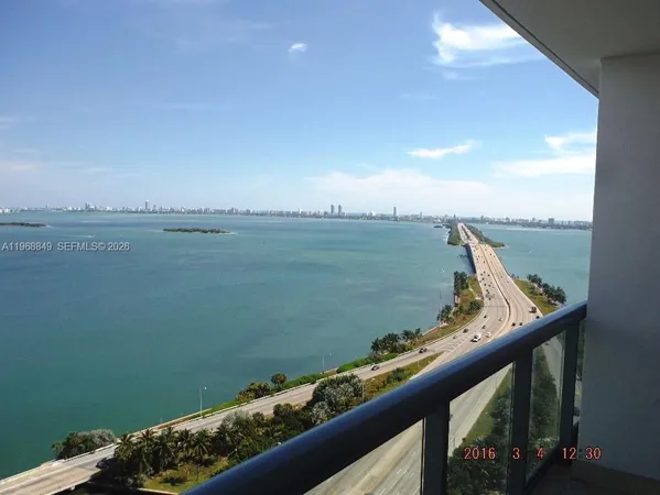 a view of a balcony with an ocean