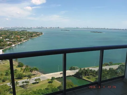 a view of a lake from a balcony