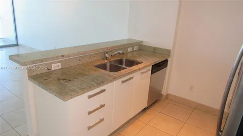 a utility room with washer and dryer