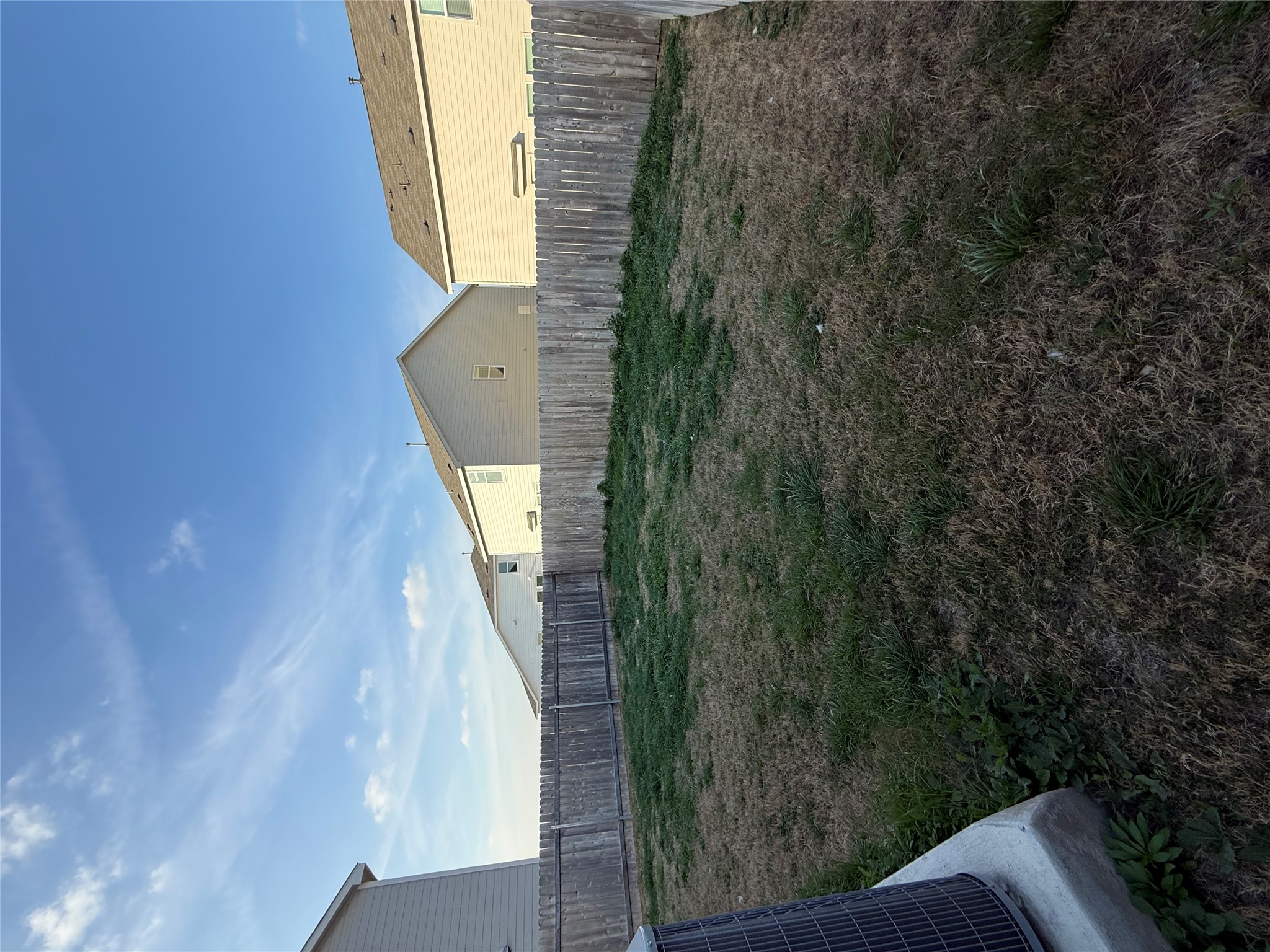 23408 Tiny Moons Way Elgin, TX 78621 - Photo 11 of 11 a view of a back yard