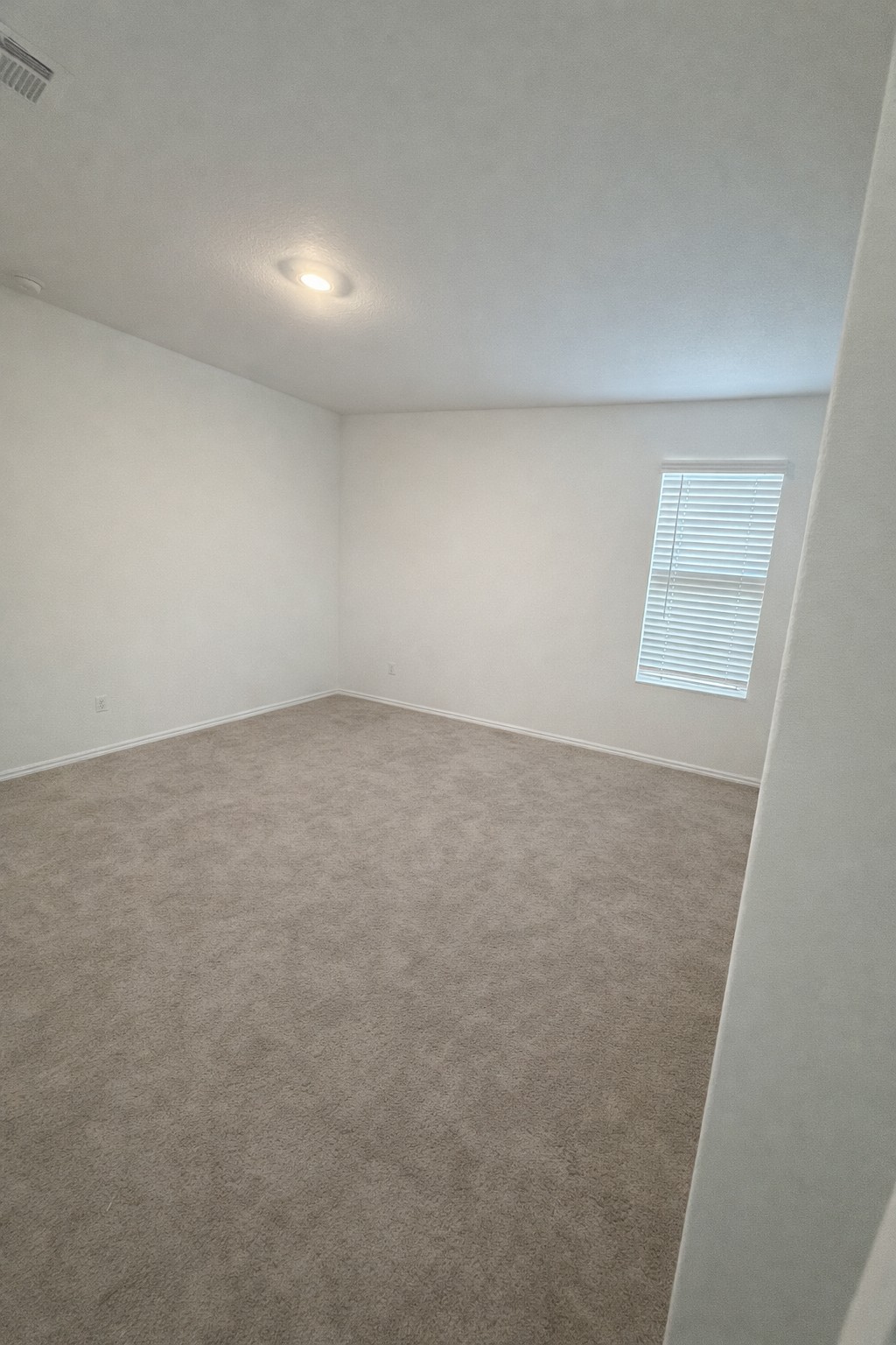 23408 Tiny Moons Way Elgin, TX 78621 - Photo 4 of 11 an empty room with windows