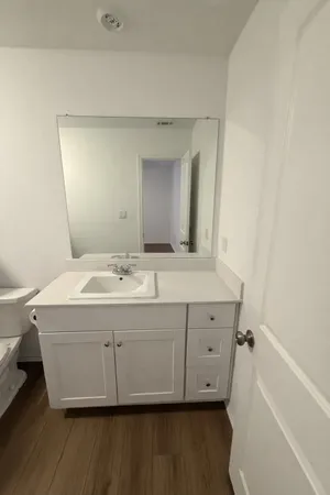 a bathroom with a double vanity sink and mirror