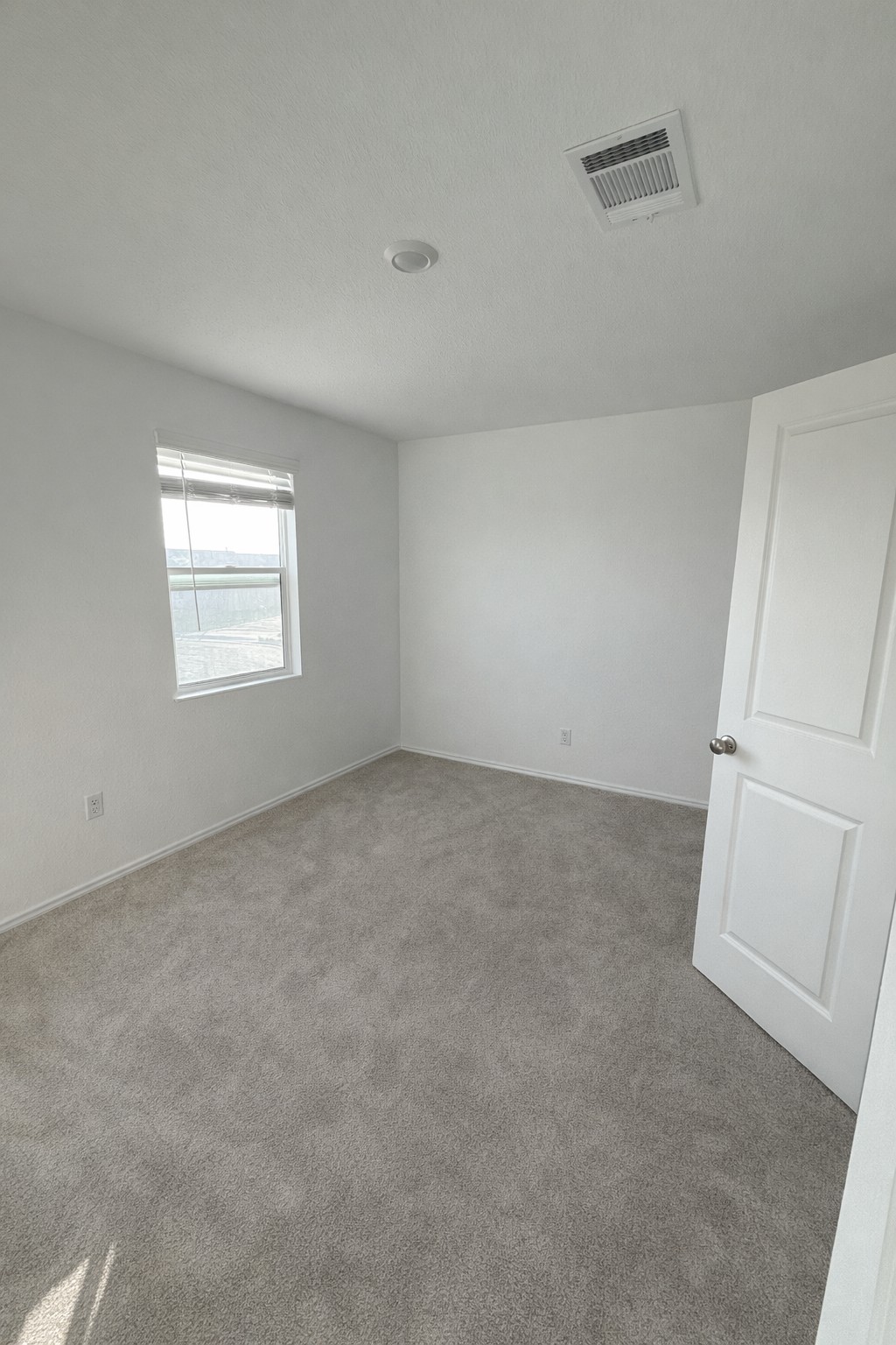 23408 Tiny Moons Way Elgin, TX 78621 - Photo 7 of 11 an empty room with a window