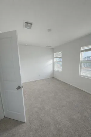 an empty room with windows