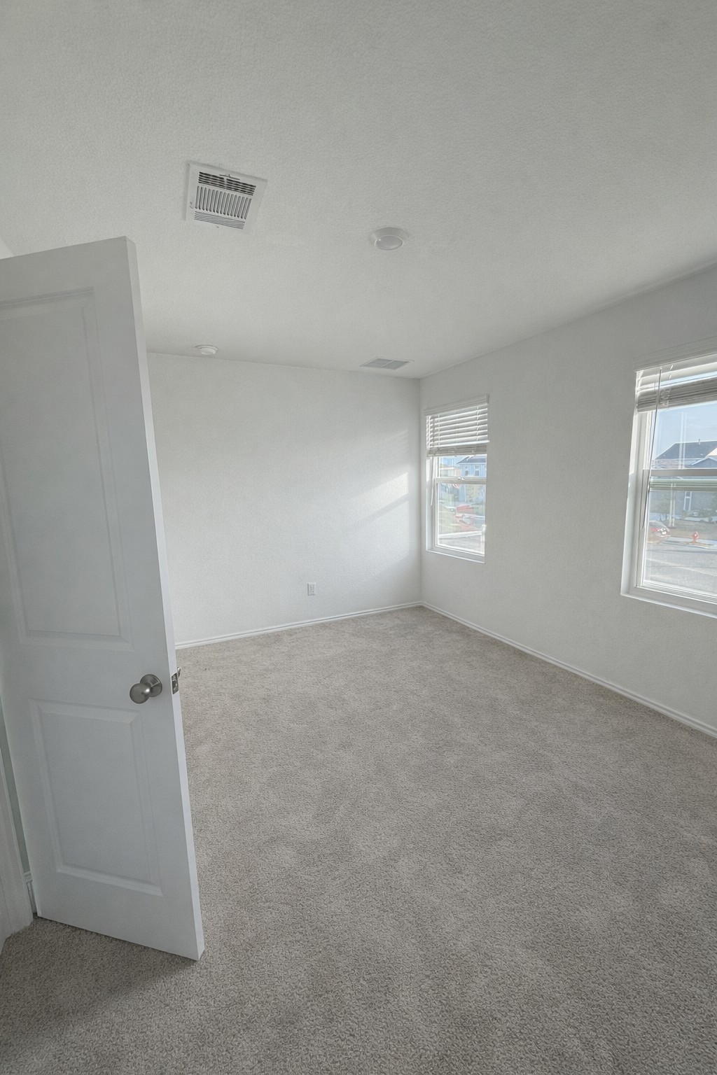 23408 Tiny Moons Way Elgin, TX 78621 - Photo 9 of 11 an empty room with windows