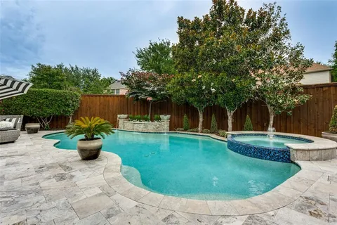 a view of a backyard with swimming pool