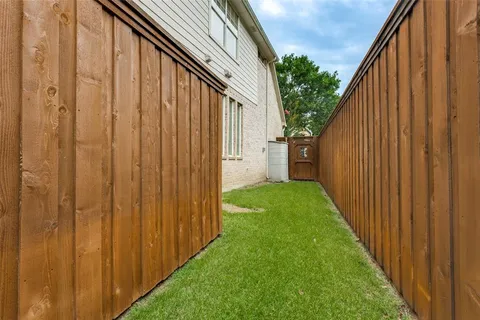 a view of a back yard from a balcony