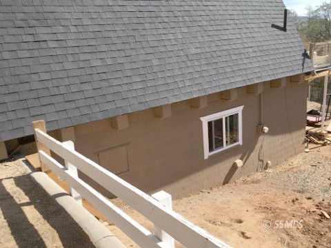 74 Adams Road Wofford Heights, CA 93285 - Photo 11 of 15 a view of wooden staircase and a building