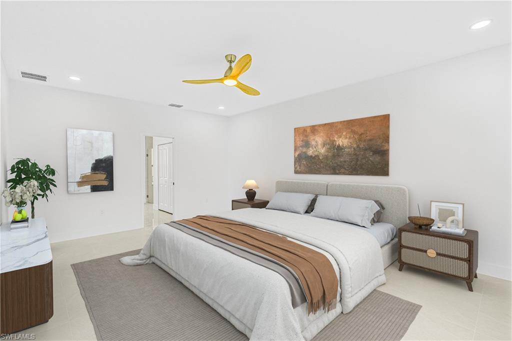 343 Pullman Street Lehigh Acres, FL 33974 - Photo 15 of 43 a bedroom with a bed and a painting on the wall