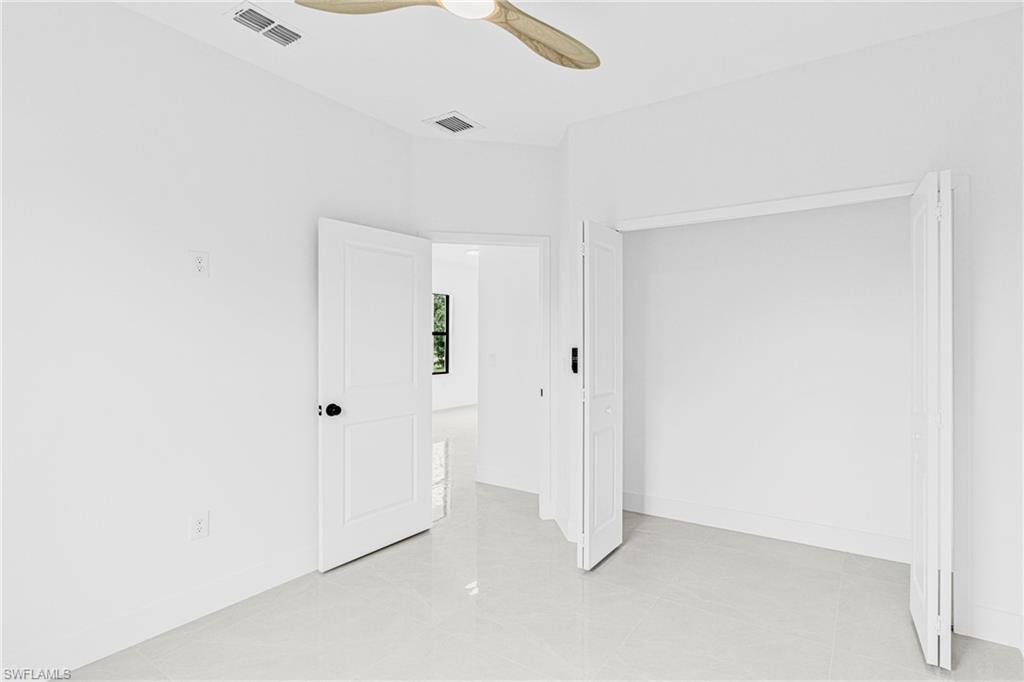 343 Pullman Street Lehigh Acres, FL 33974 - Photo 27 of 43 a view of an empty room