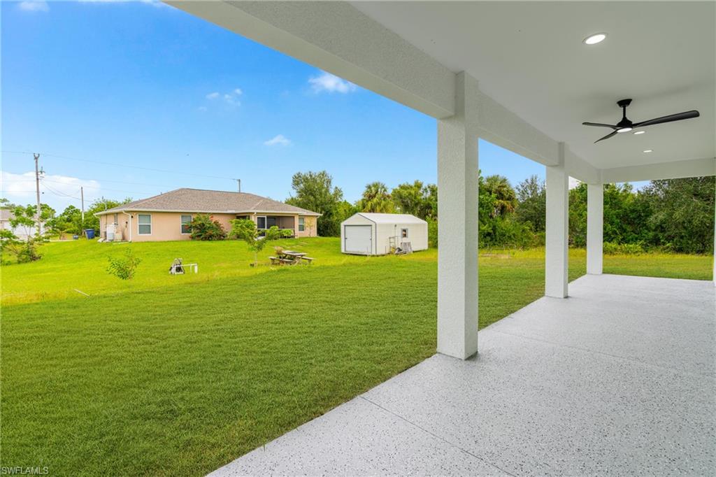 343 Pullman Street Lehigh Acres, FL 33974 - Photo 29 of 43 a view of a garden with an outdoor space