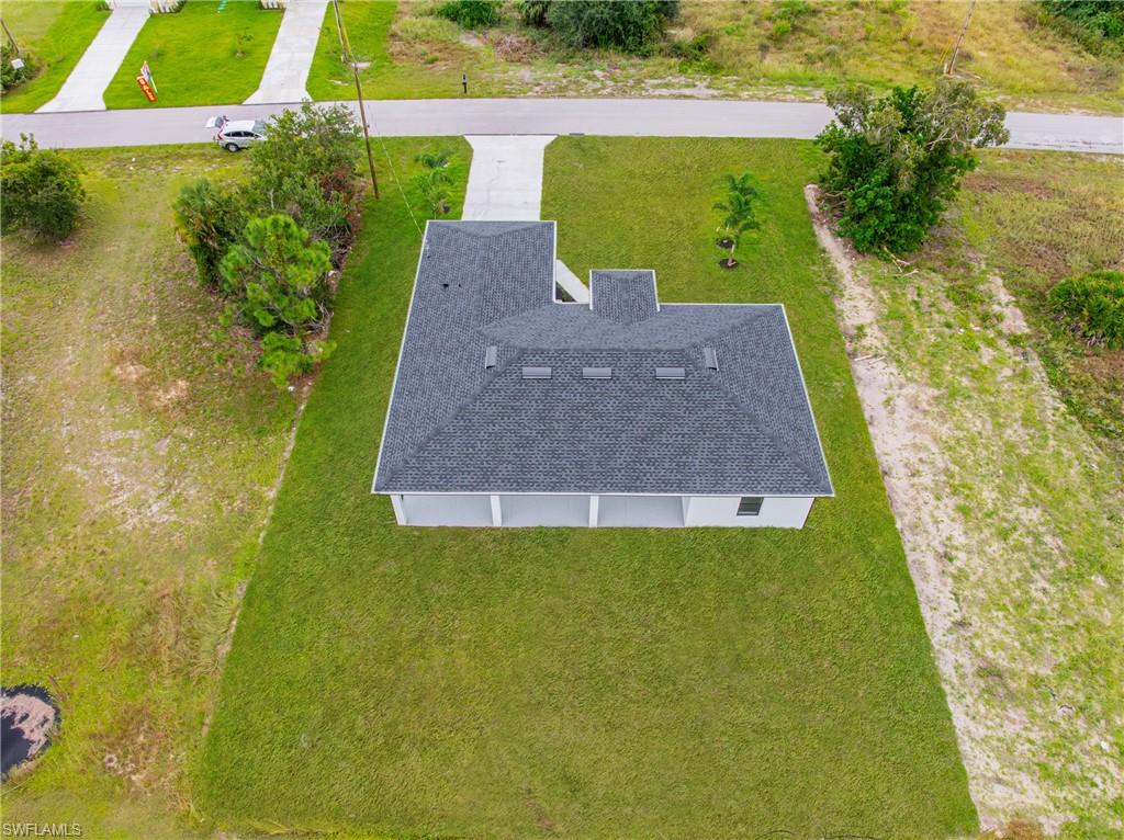 343 Pullman Street Lehigh Acres, FL 33974 - Photo 35 of 43 a view of a yard with an outdoor space