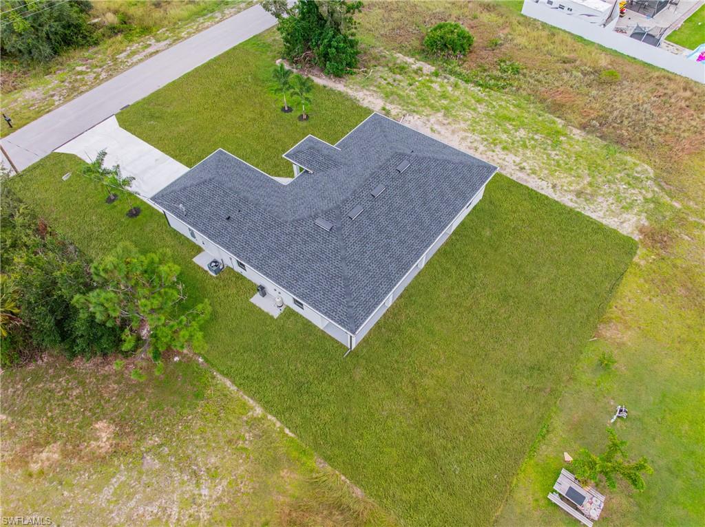 343 Pullman Street Lehigh Acres, FL 33974 - Photo 36 of 43 a view of a yard with an outdoor space