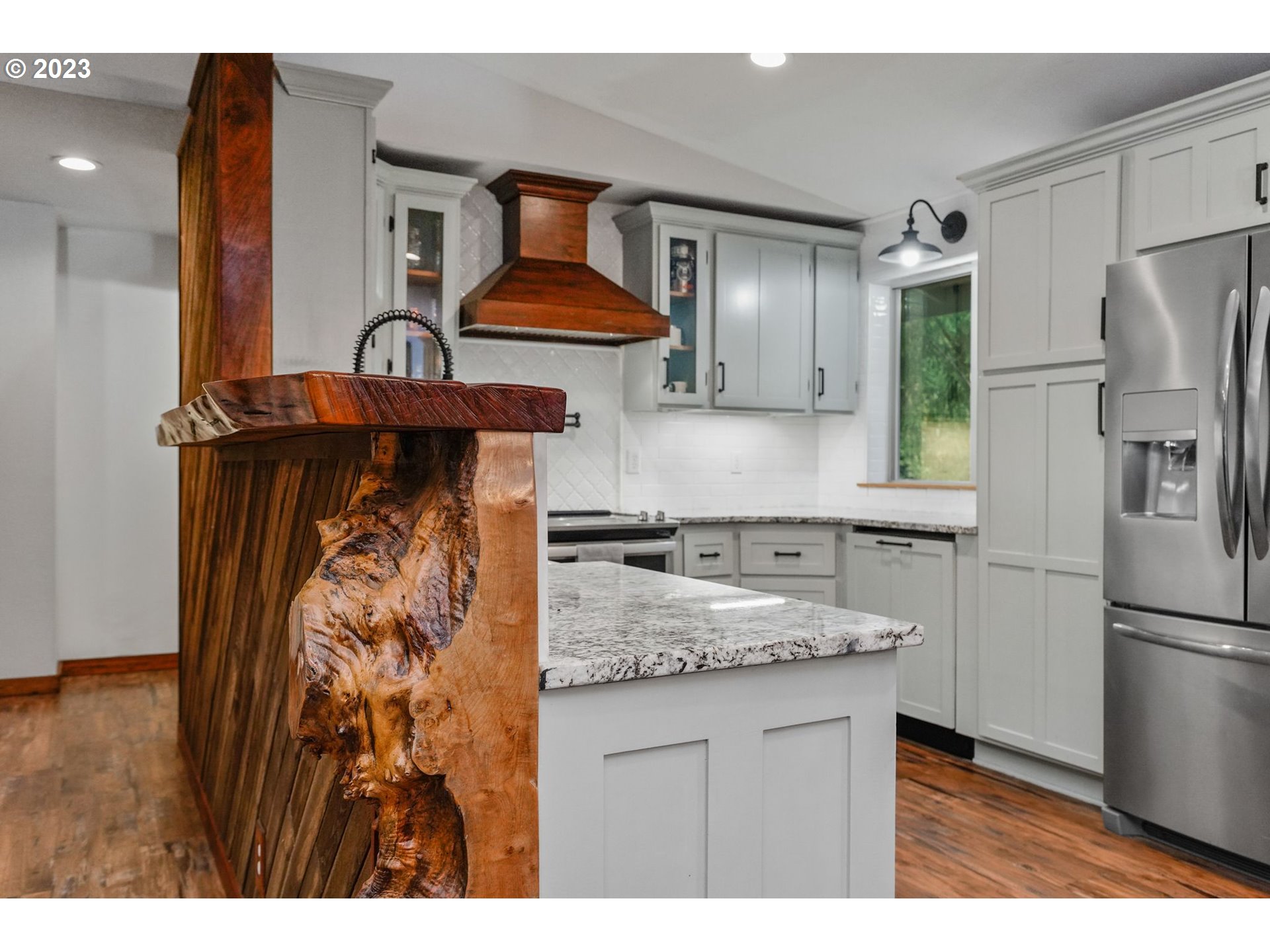 54795 Southwest Hebo Road Grand Ronde, OR 97347 - Photo 13 of 41 a kitchen with stainless steel appliances granite countertop a refrigerator and a sink