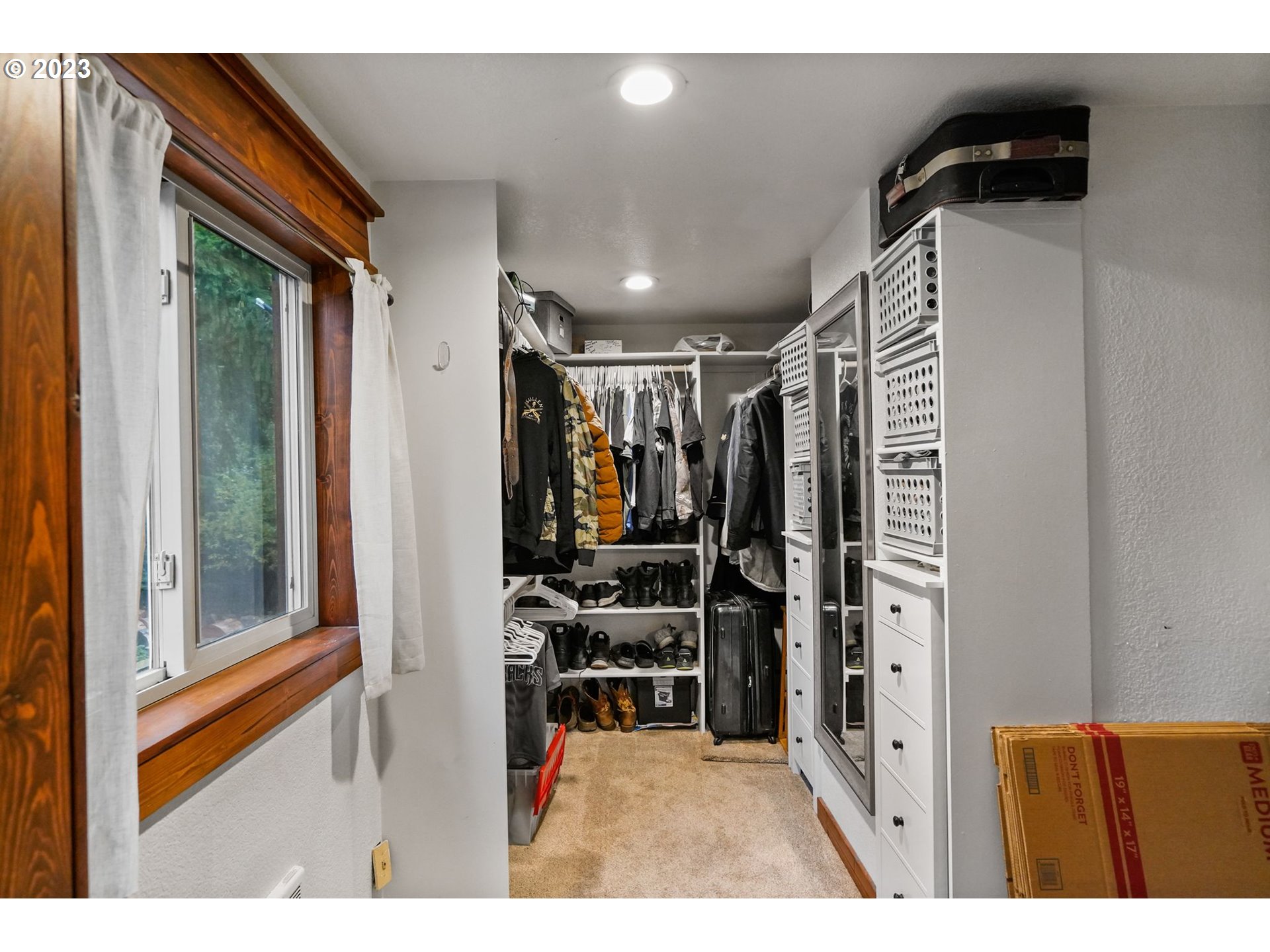 54795 Southwest Hebo Road Grand Ronde, OR 97347 - Photo 18 of 41 a view of walk in closet with clothes and shoes