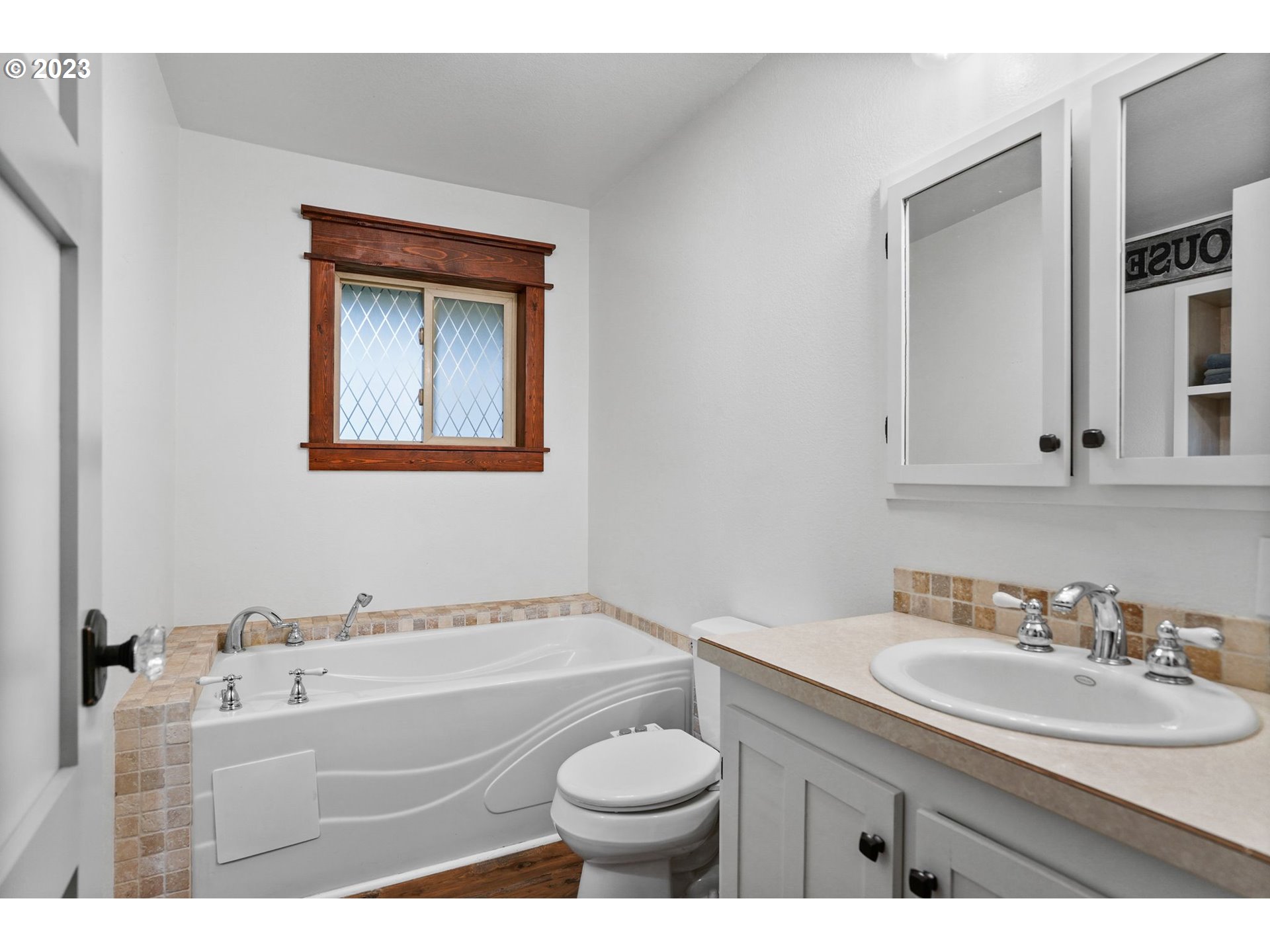 54795 Southwest Hebo Road Grand Ronde, OR 97347 - Photo 25 of 41 a bathroom with a granite countertop sink toilet and mirror