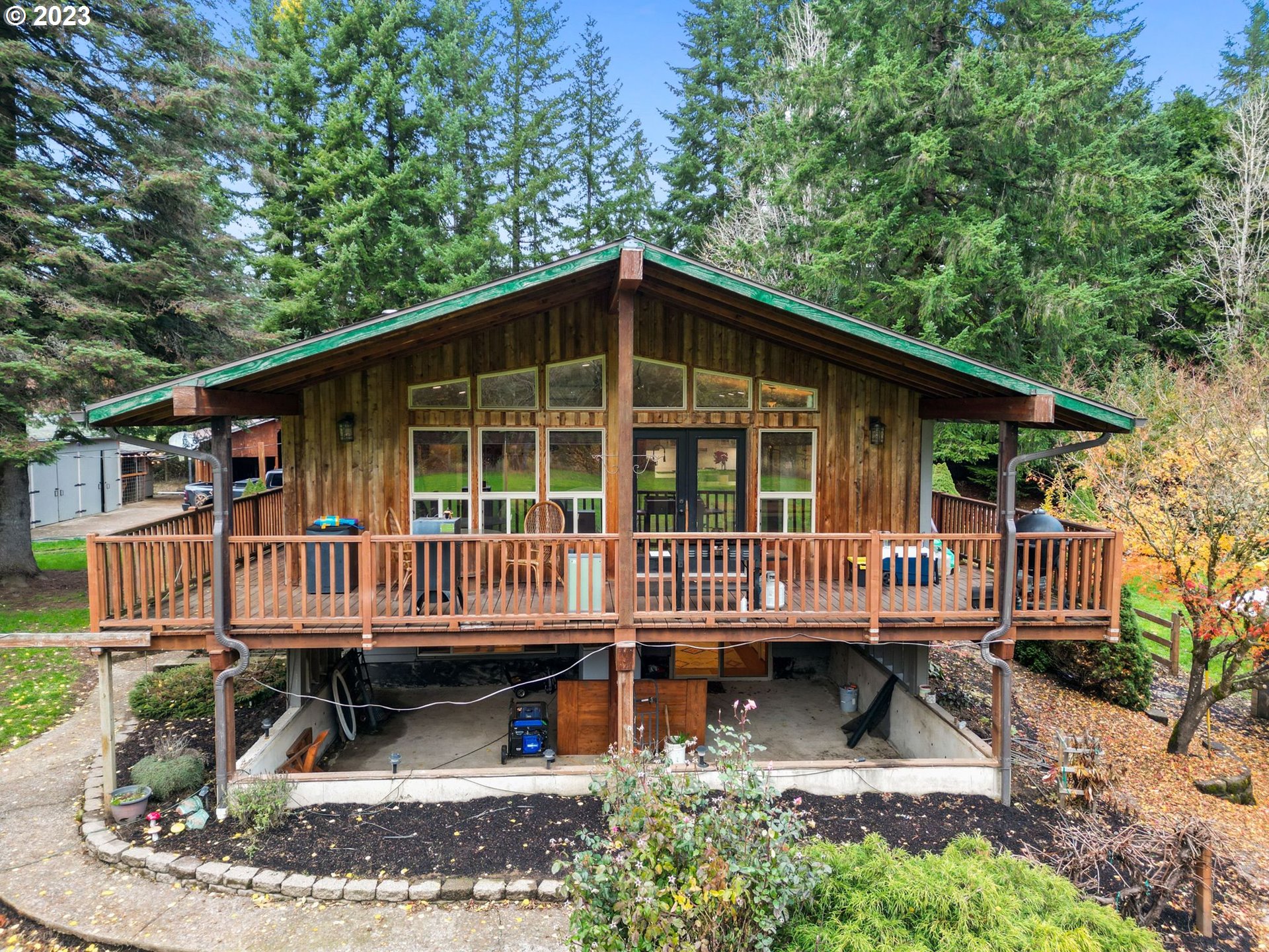 54795 Southwest Hebo Road Grand Ronde, OR 97347 - Photo 28 of 41 a view of a house with a yard deck and a patio
