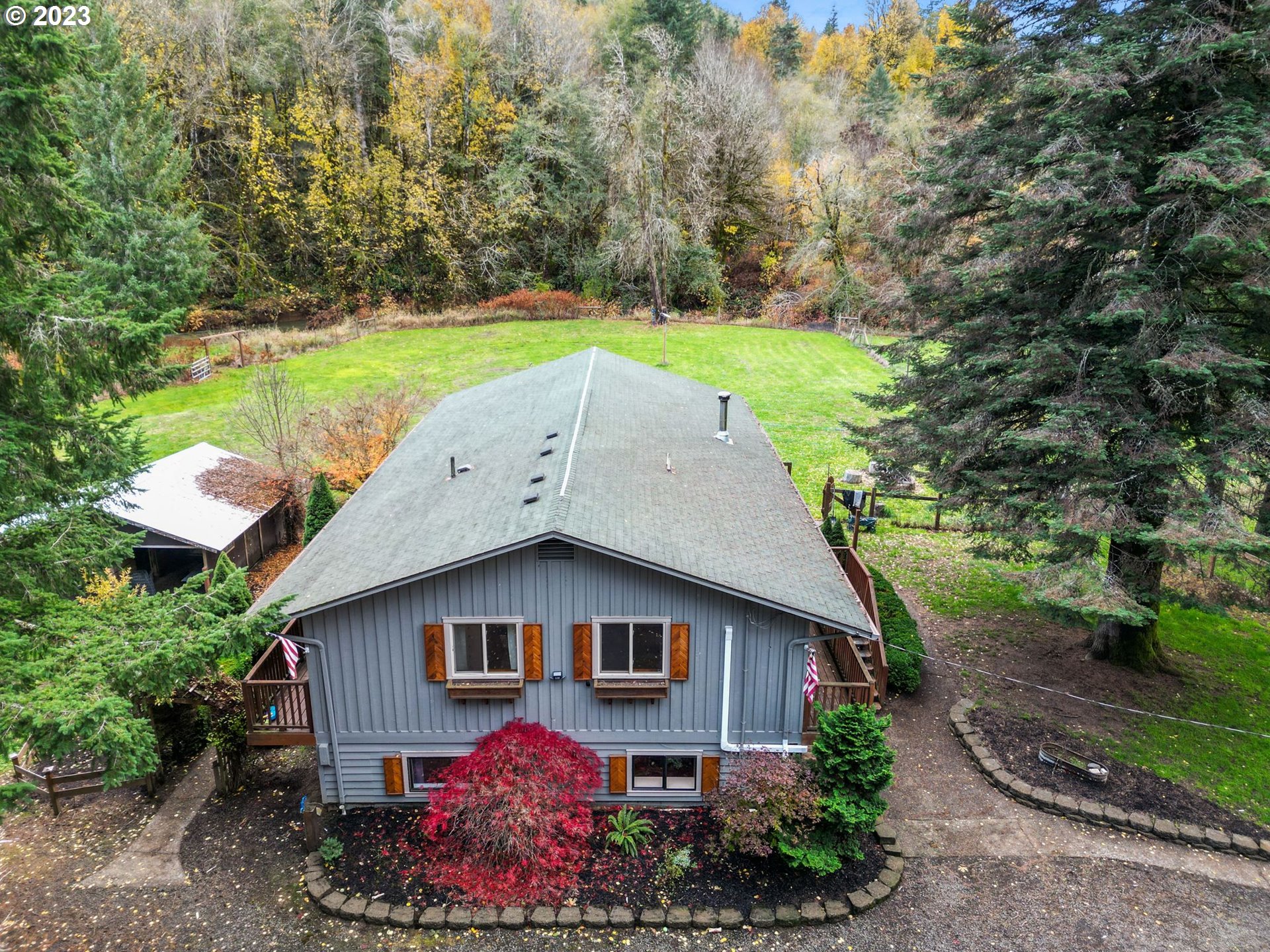 54795 Southwest Hebo Road Grand Ronde, OR 97347 - Photo 3 of 41 a house view with a garden space