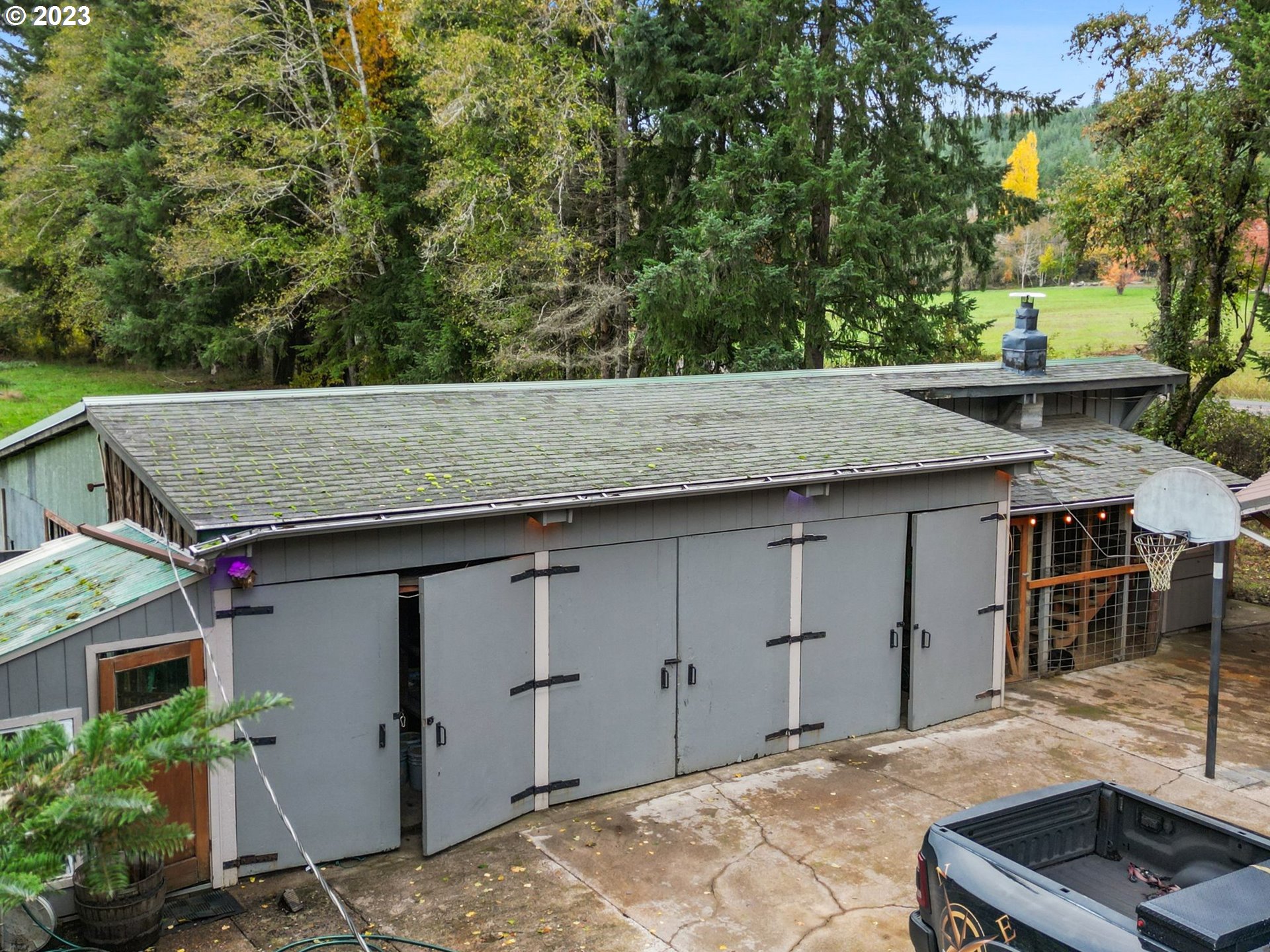 54795 Southwest Hebo Road Grand Ronde, OR 97347 - Photo 31 of 41 a backyard of a house with table and chairs