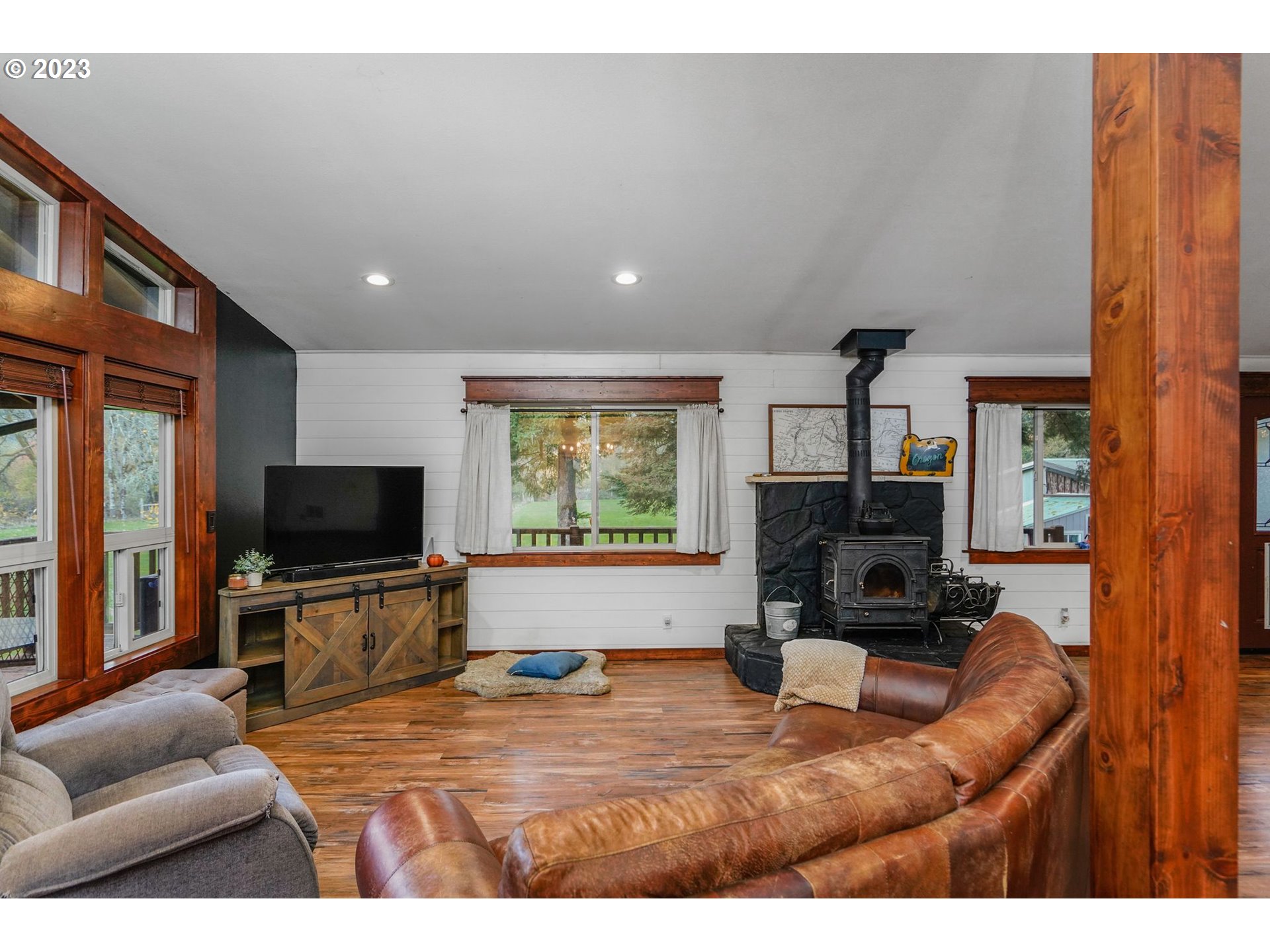 54795 Southwest Hebo Road Grand Ronde, OR 97347 - Photo 10 of 41 a living room with furniture and a flat screen tv