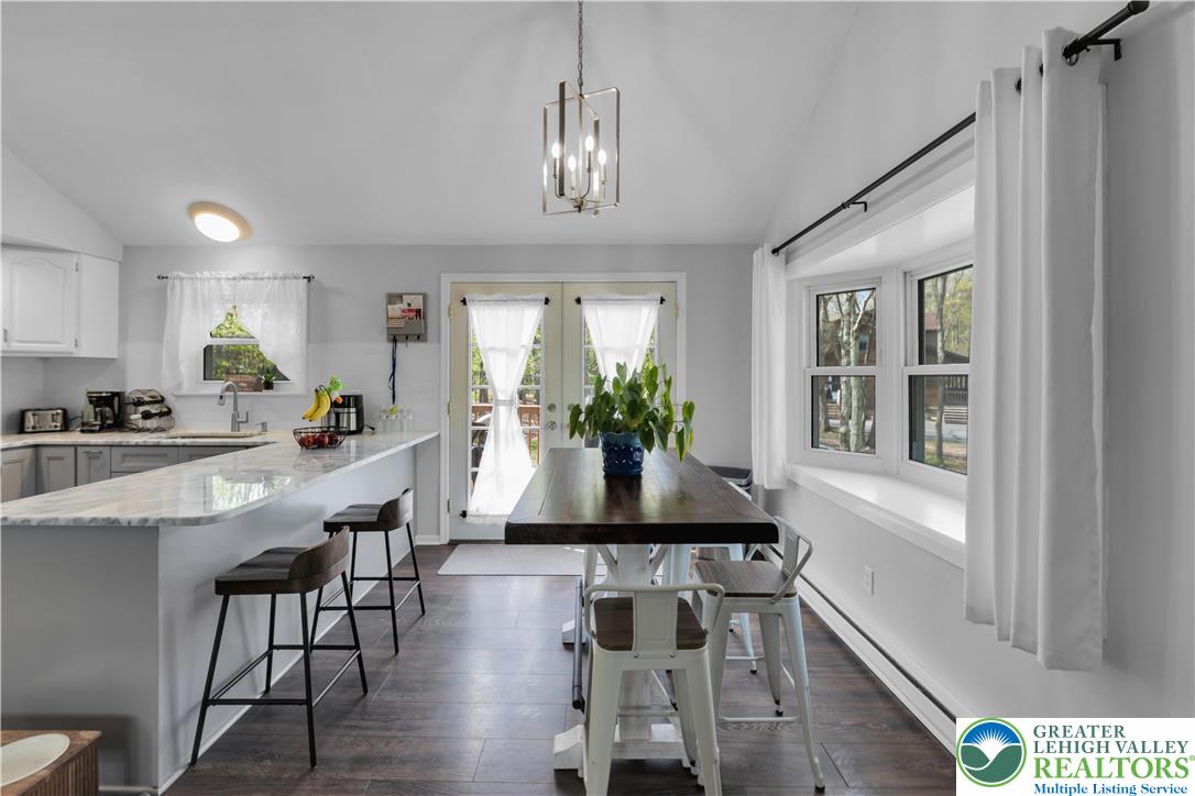 107 Shenkel Road Effort, PA 18330 - Photo 13 of 44 a kitchen with a table and chairs in it
