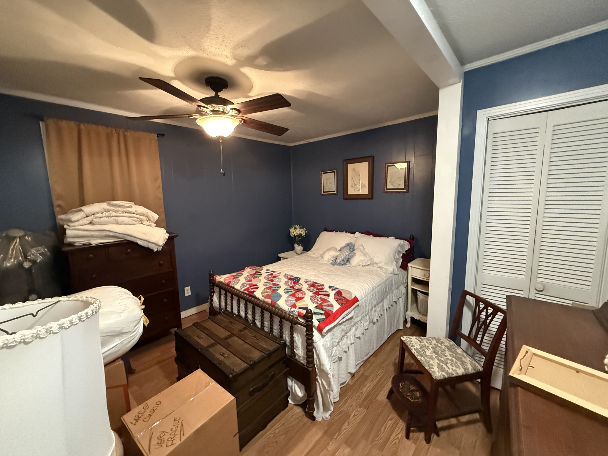 201 South Point Drive Camden, TN 38320 - Photo 14 of 30 a bedroom with a bed and wooden floor