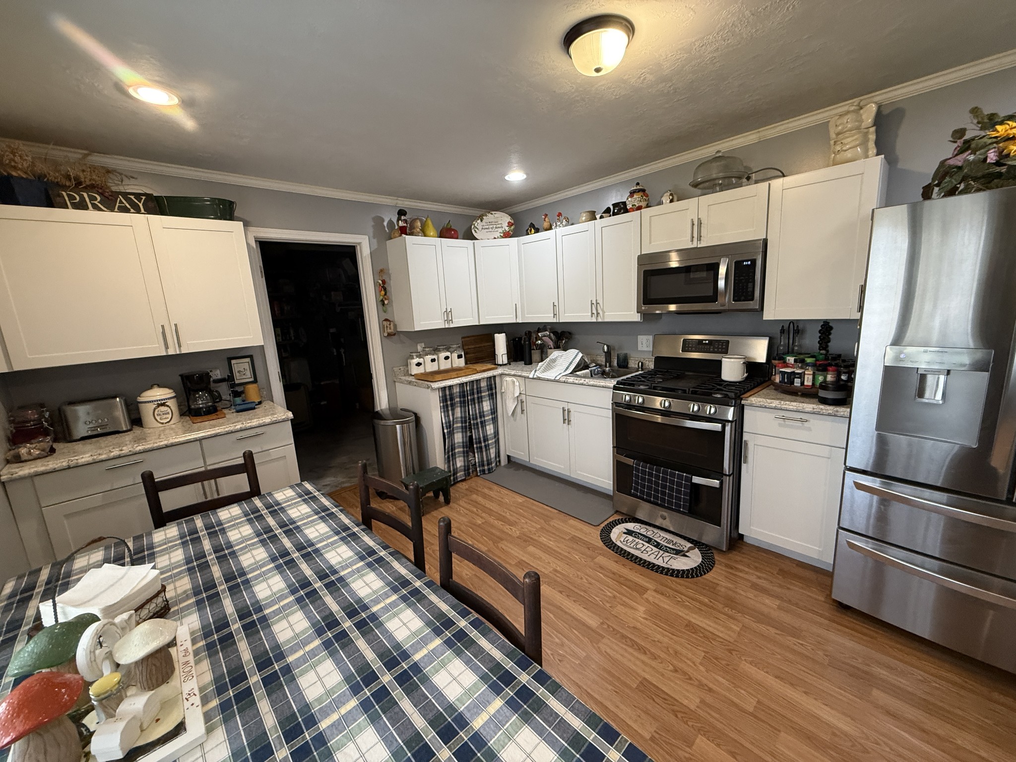 201 South Point Drive Camden, TN 38320 - Photo 24 of 30 a kitchen with stainless steel appliances wooden cabinets and a stove top oven