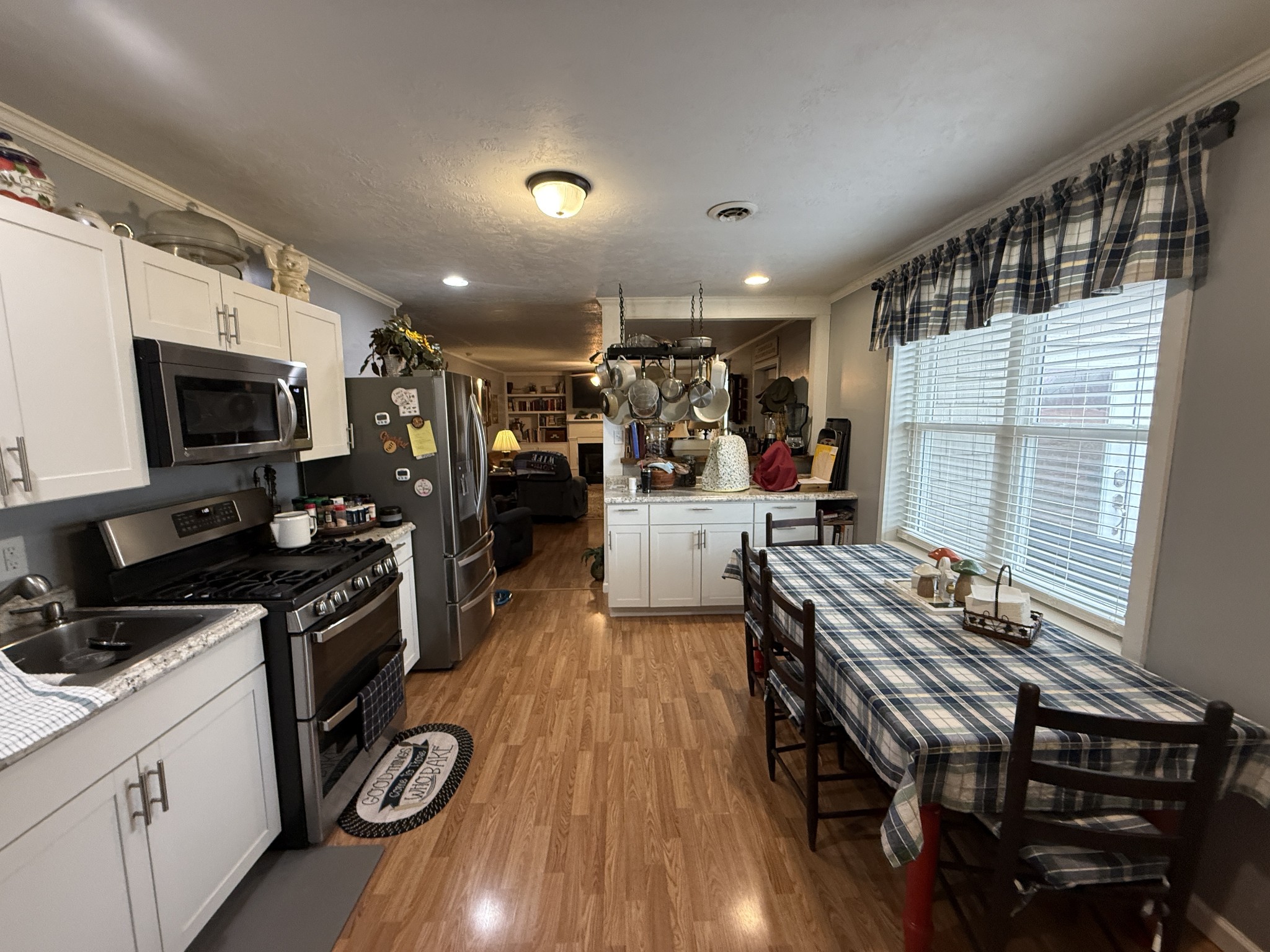 201 South Point Drive Camden, TN 38320 - Photo 27 of 30 a kitchen with sink a stove and cabinets