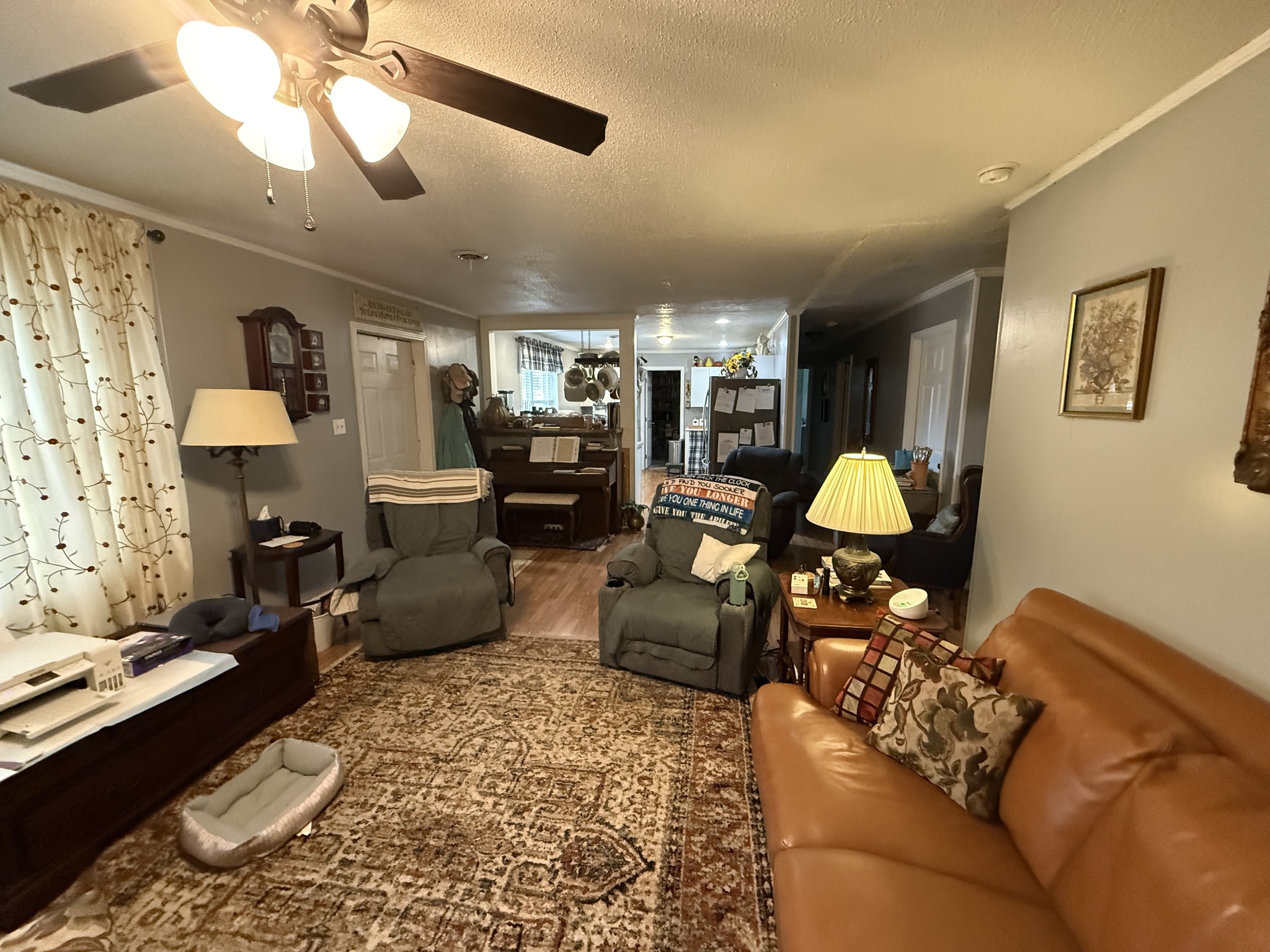 201 South Point Drive Camden, TN 38320 - Photo 29 of 30 a living room with furniture and a chandelier