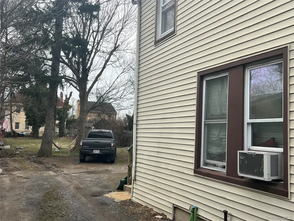 a view of a car park in front of house