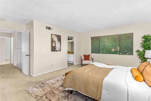 a bedroom with a bed and a couch