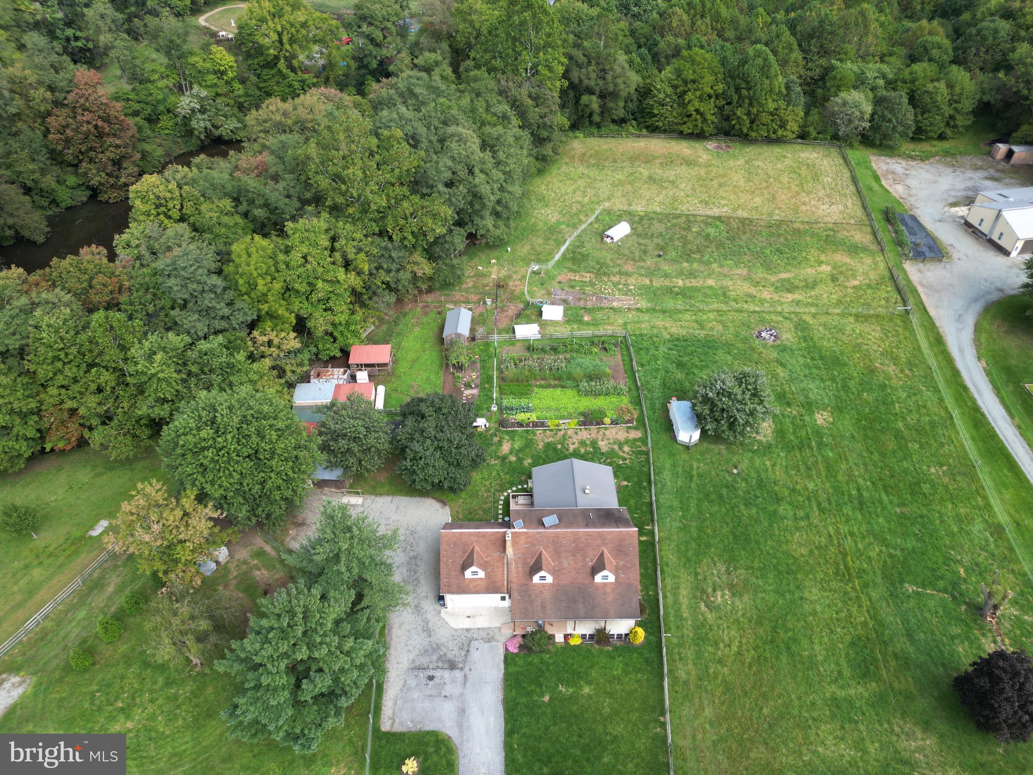 69 Fairview Road New Providence, PA 17560 - Photo 24 of 59 a aerial view of residential houses with outdoor space and trees