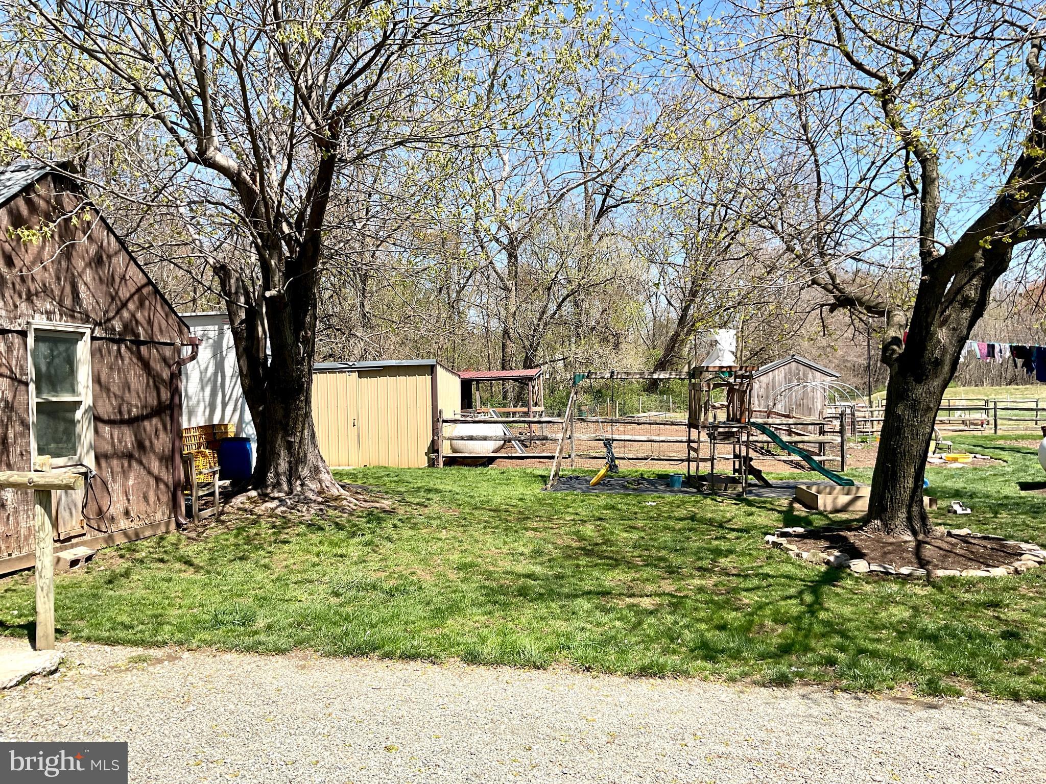 69 Fairview Road New Providence, PA 17560 - Photo 29 of 59 a backyard of a house with a table and chairs