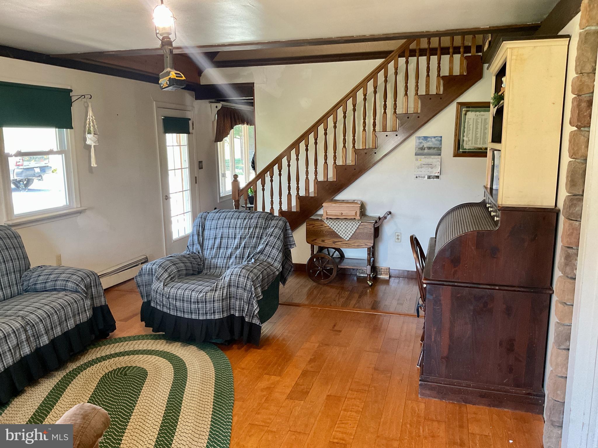 69 Fairview Road New Providence, PA 17560 - Photo 39 of 59 a living room with furniture and a chandelier