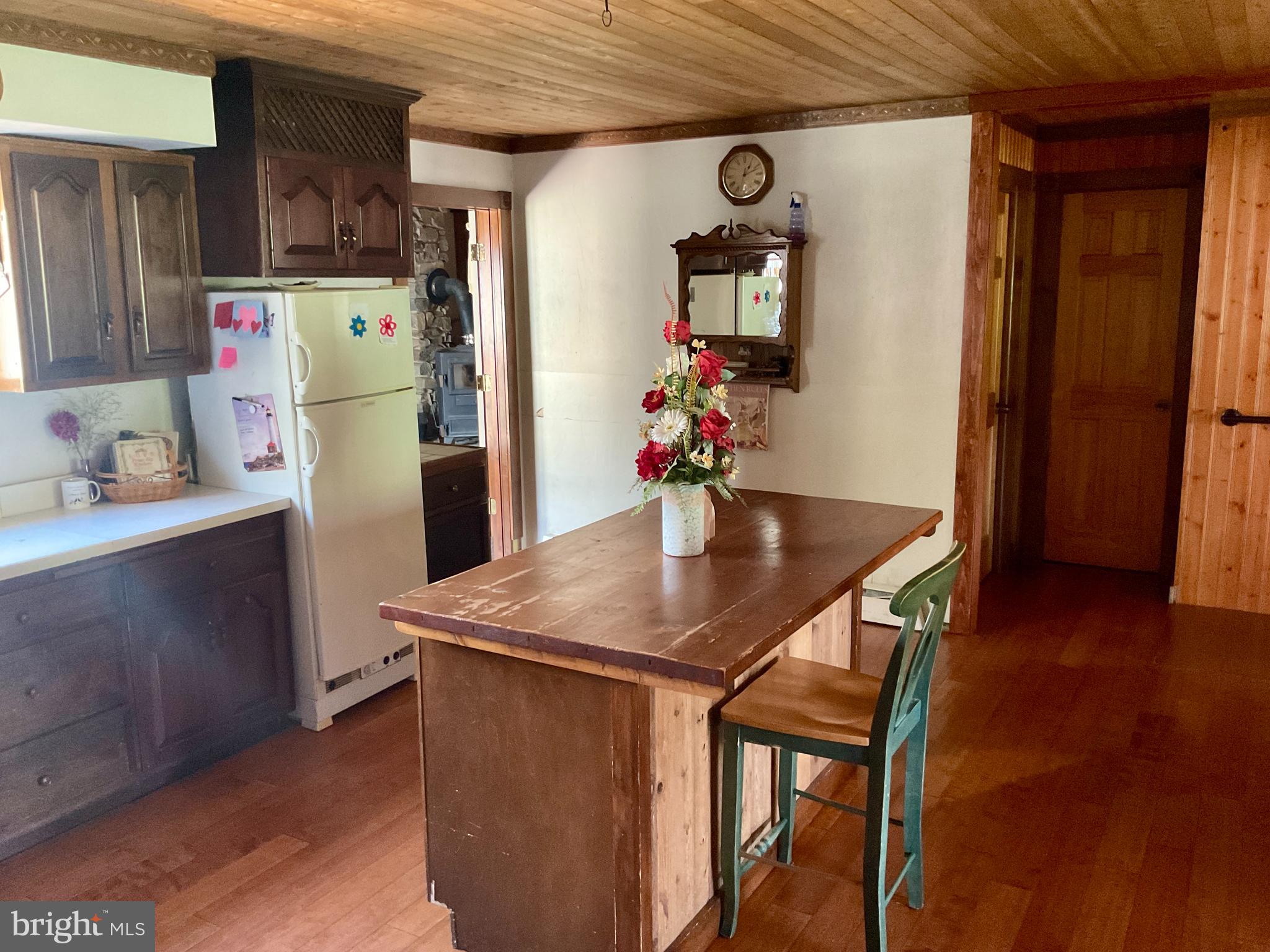 69 Fairview Road New Providence, PA 17560 - Photo 41 of 59 a kitchen with stainless steel appliances granite countertop a refrigerator a stove and a wooden floors