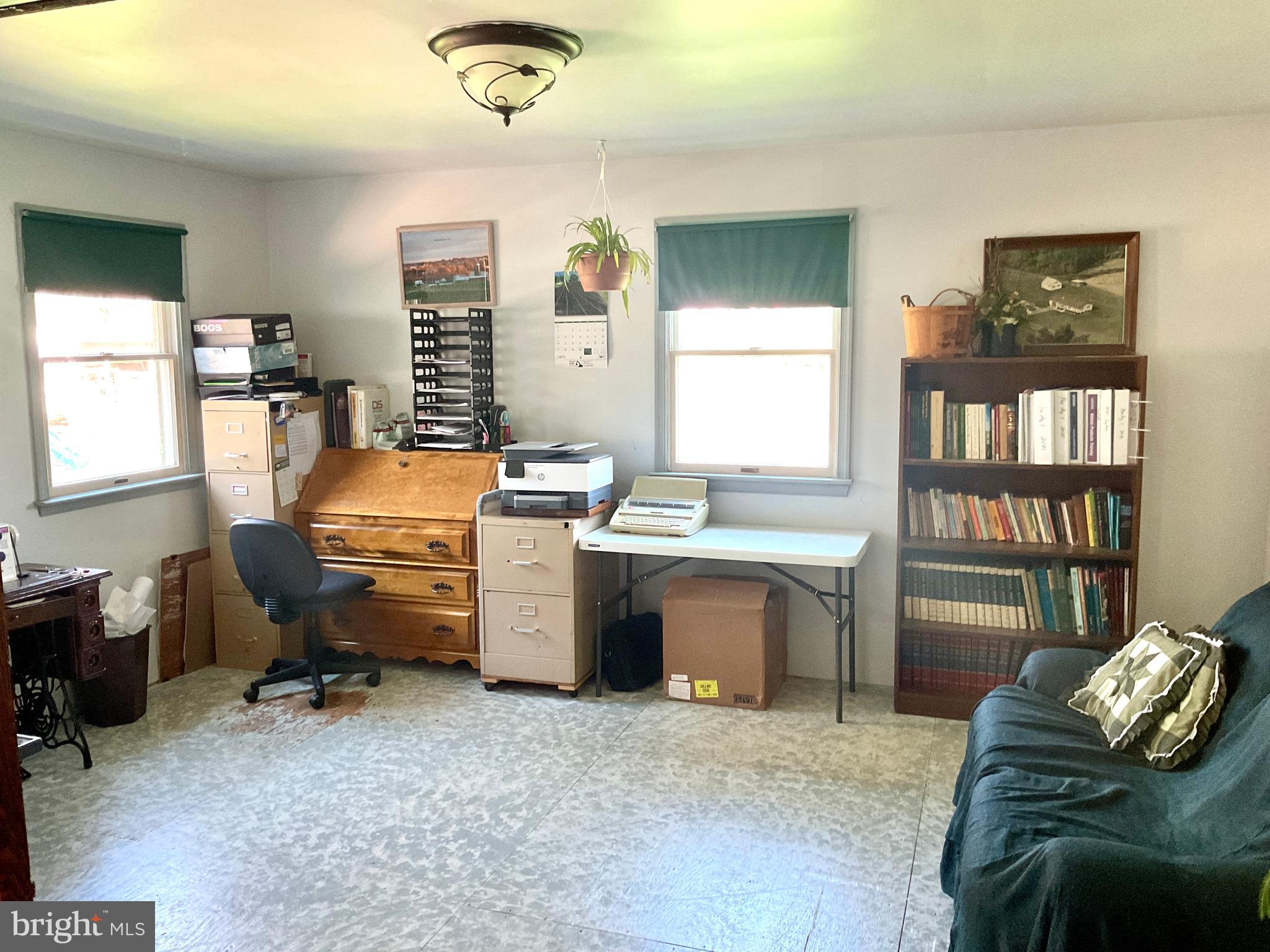 69 Fairview Road New Providence, PA 17560 - Photo 44 of 59 a room with furniture a chandelier and a window