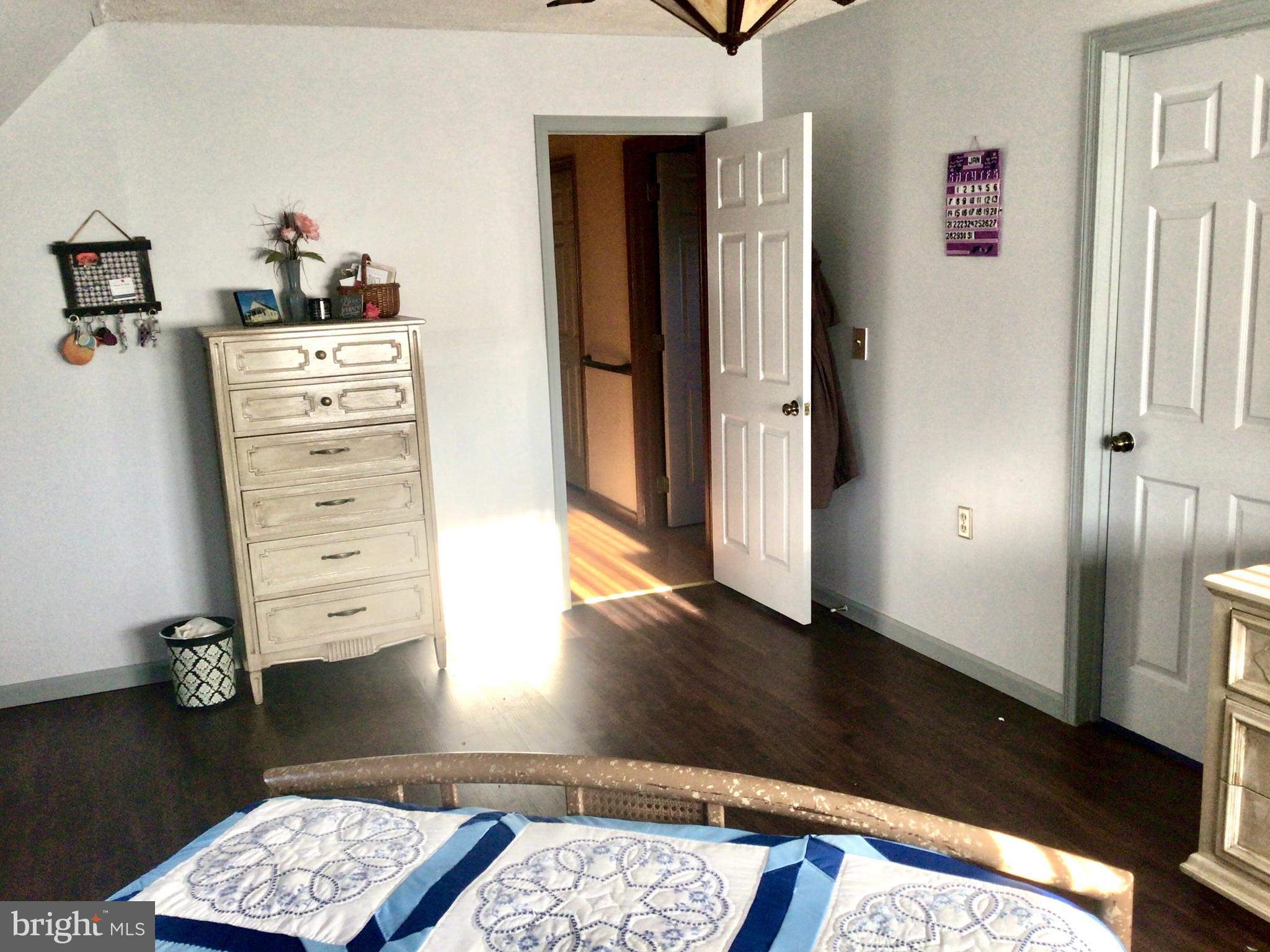 69 Fairview Road New Providence, PA 17560 - Photo 53 of 59 a view of a hallway with wooden floor and closet